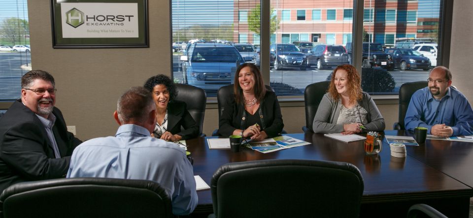 Horst Construction team sits around boardroom table