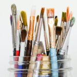 jar full of paint brushes