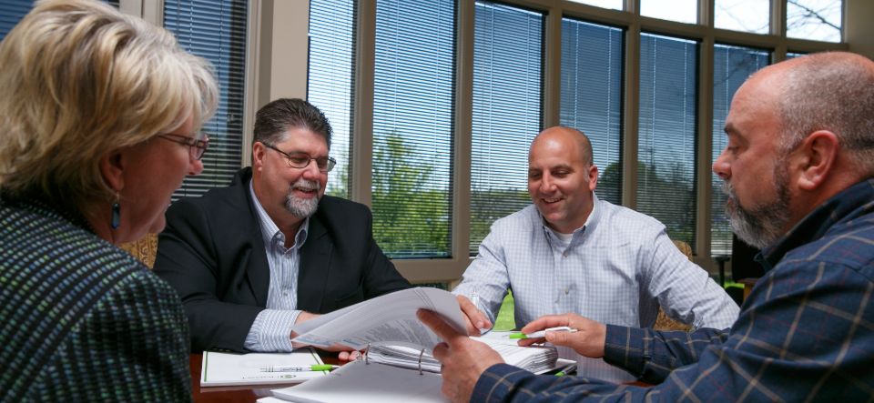 Group of professionals around table