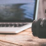 Still shot of DLSR camera with laptop and cell phone