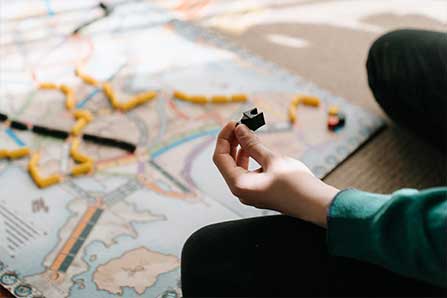 boy playing board game