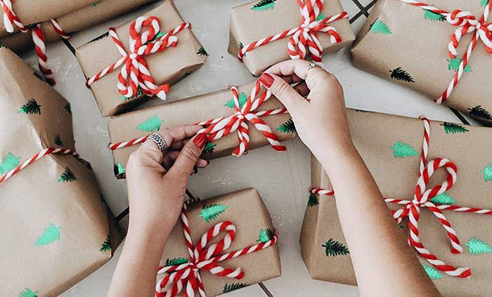 woman wrapping christmas presents