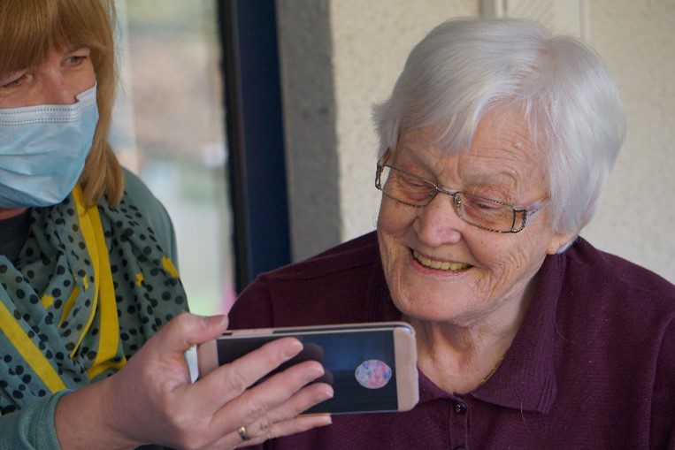 senior using cell phone