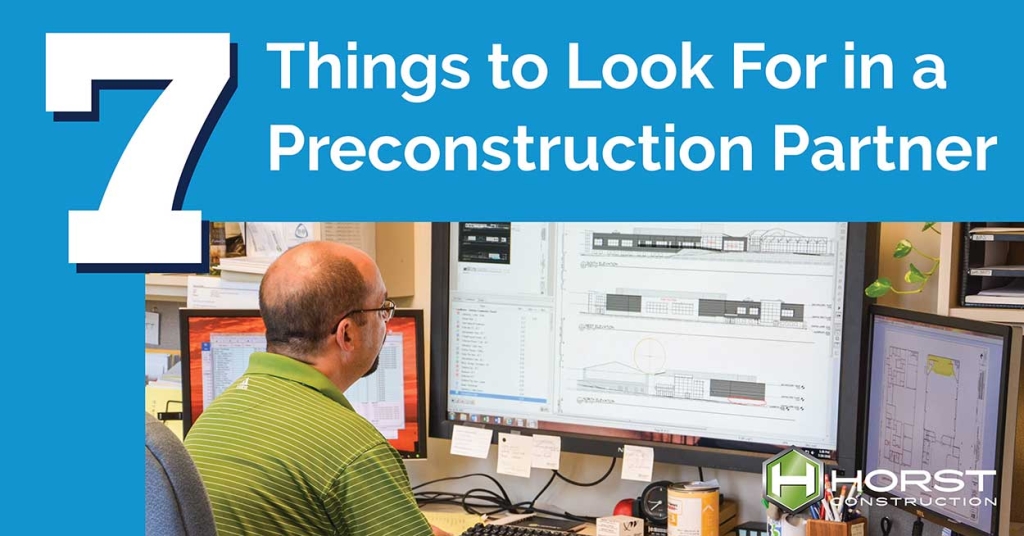 man sitting at computer working on preconstruction