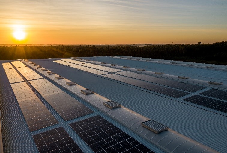 solar panels on commercial roof sunset