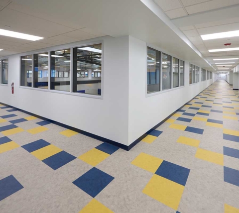 private school hallway with white walls and patterned floor