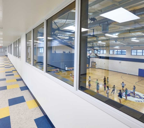 private school hallway windows overlooking gym