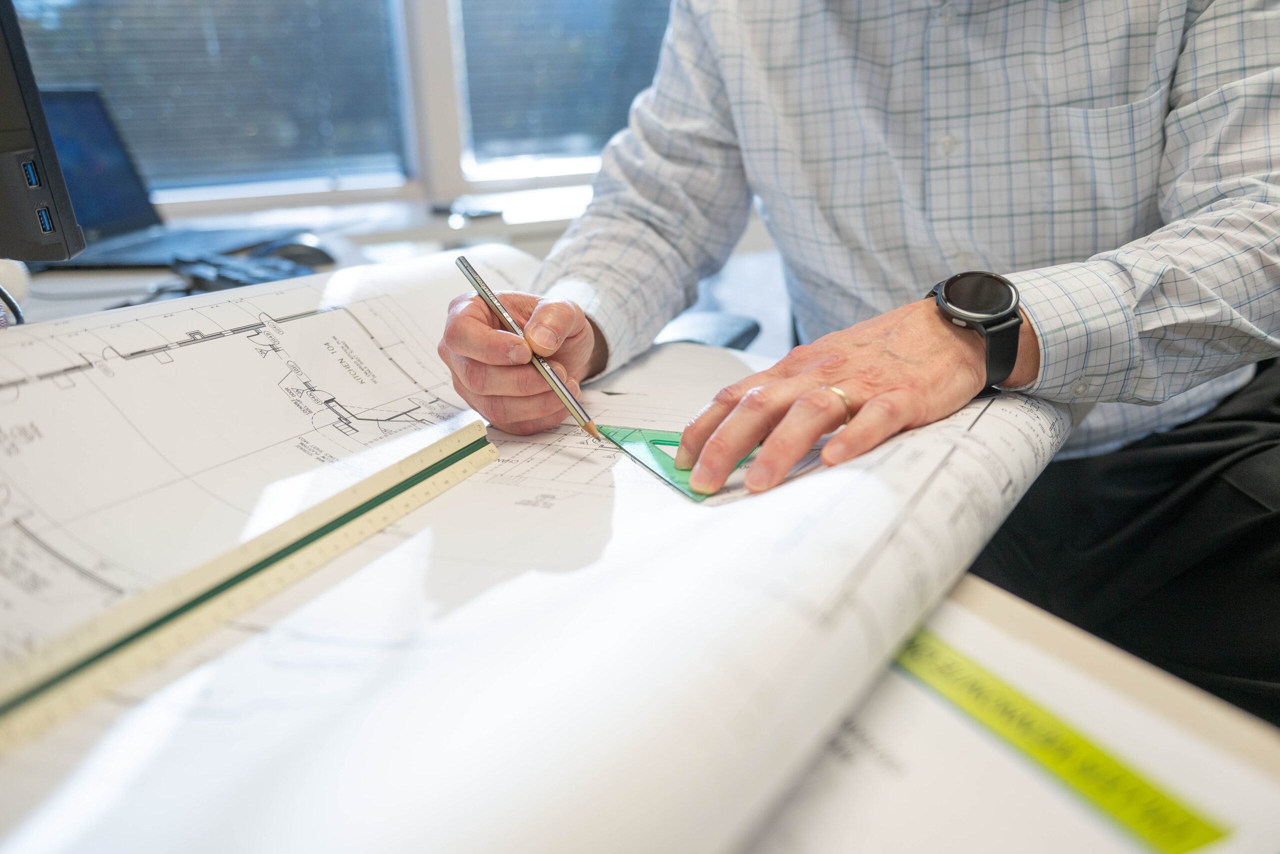 hands drawing on blueprint